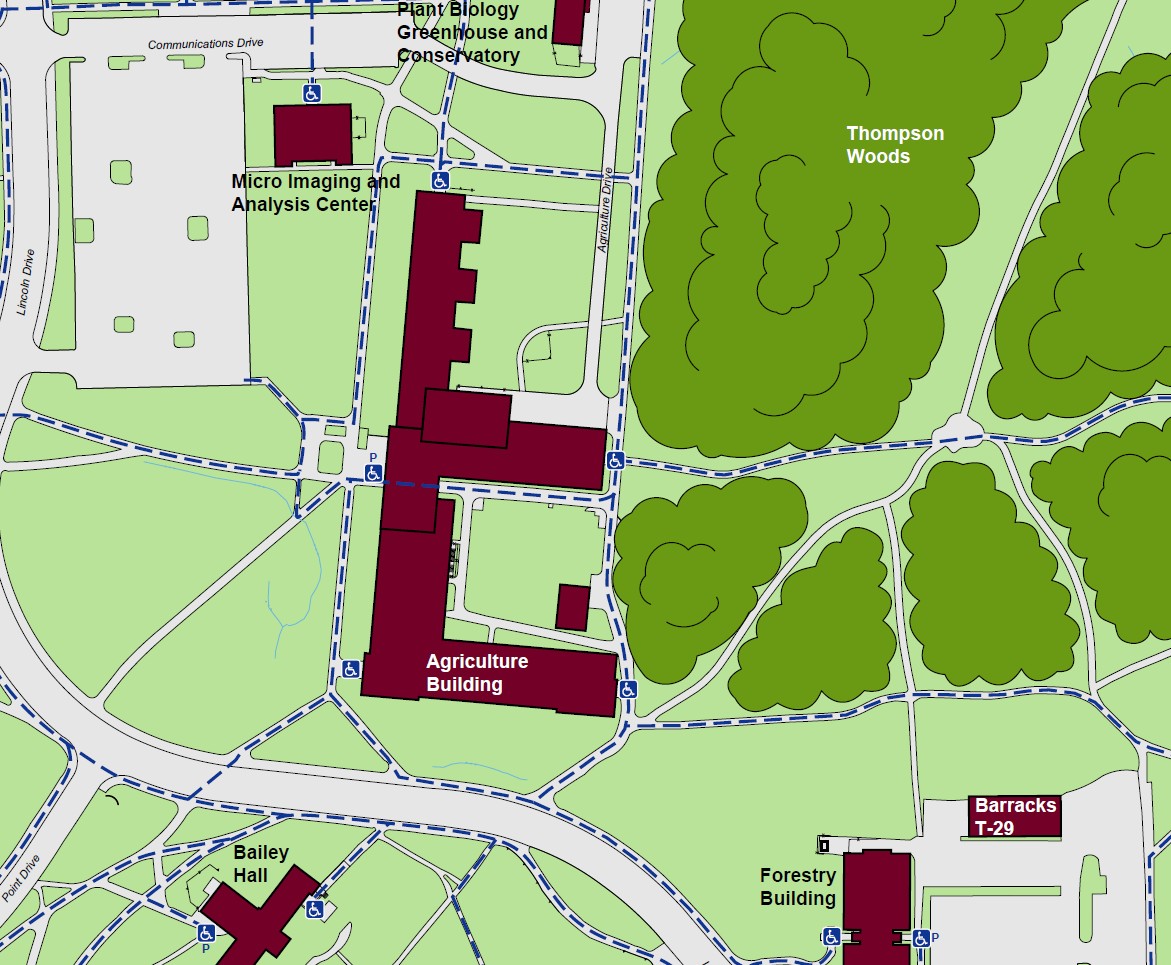 Displaying accessible pathways to the agriculture building with standard accessible entrances on the north, east, and southwest ends of the building, with a powered door on the west side of the building. 