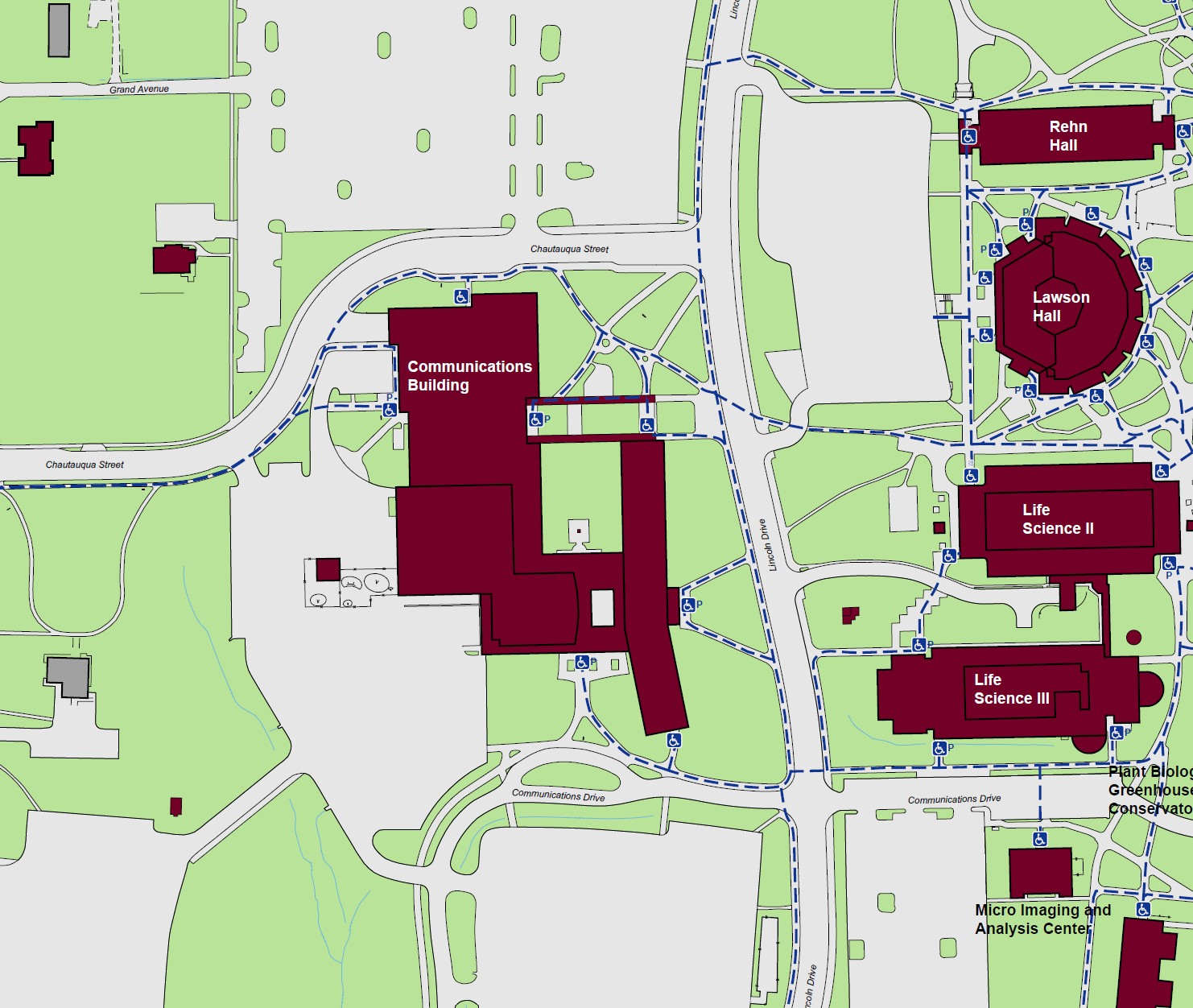 Displaying accessible pathways and entrances to the Communications Building. Standard accessible entrances can be found at the North, Northeast, and Southeast ends of the building. Powered accessible entrances are indicated at the West, South, East, and Northern central end of the building, diagonal from the intersection of Lincoln Drive and Chautauqua Street. 