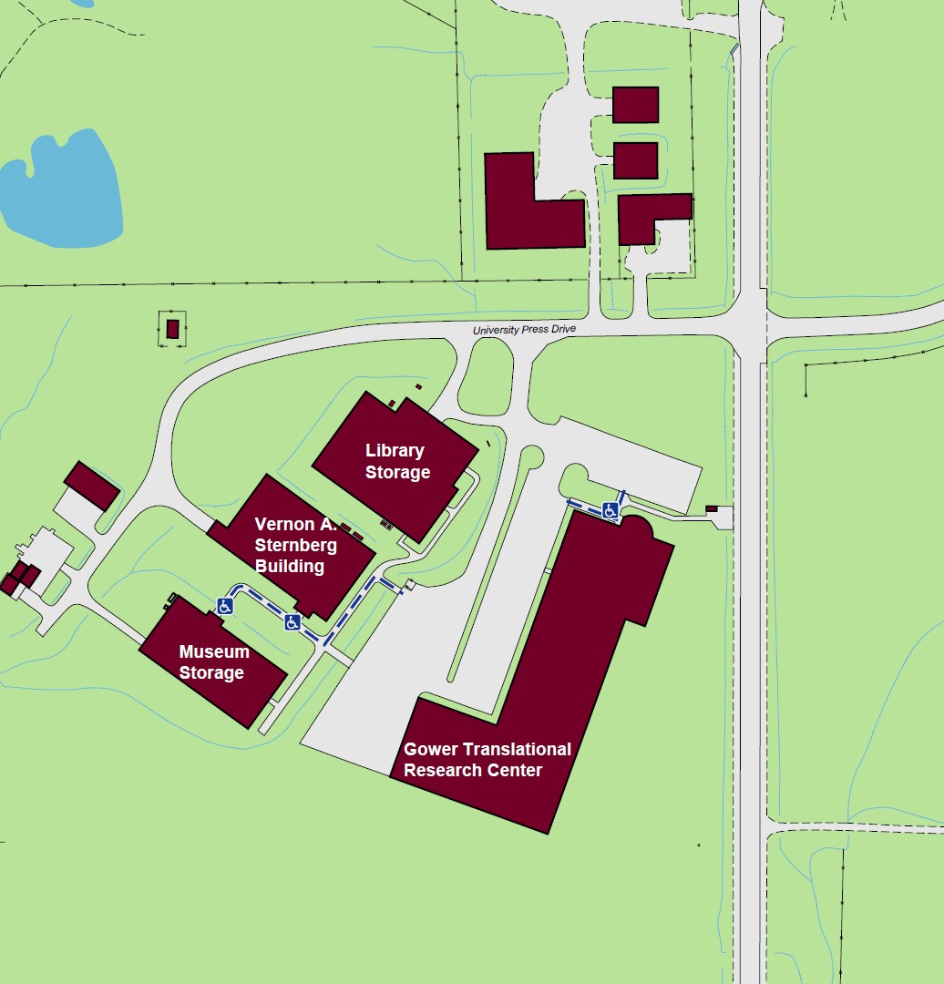 Displaying a standard accessible entrance to Gower Research Center at the notrth end of the building. 
