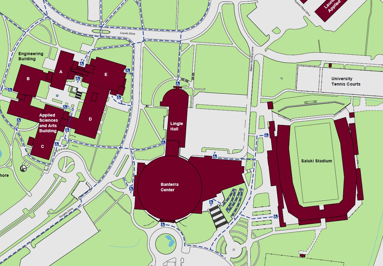 Displaying accessible pathways to the building with accessible powered entrances on the north and southwest ends of the building.